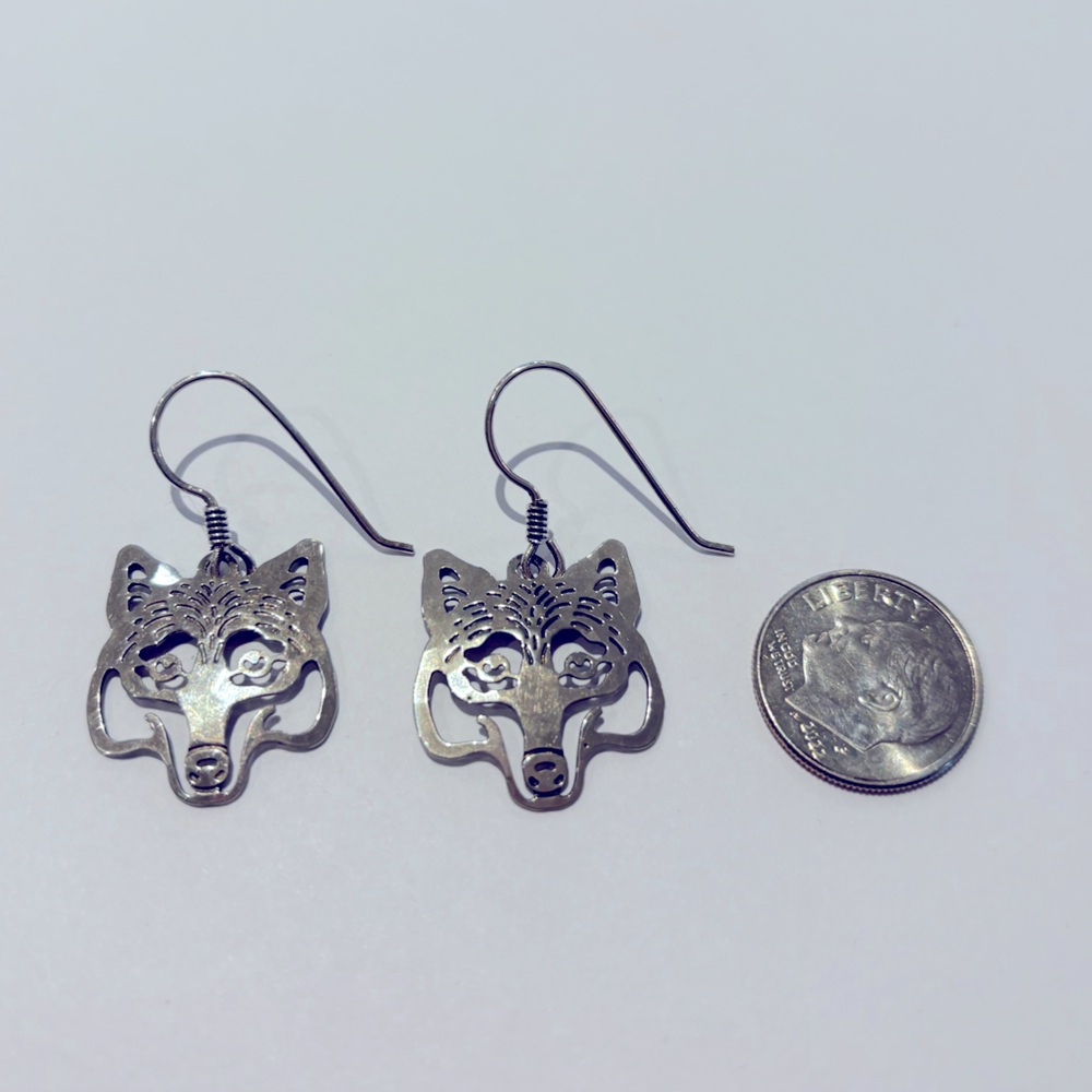 Wild Bryde silver wolf earrings.
